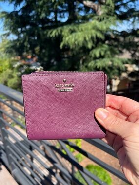 kate spade plum Saffiano zip compact wallet with gold logo